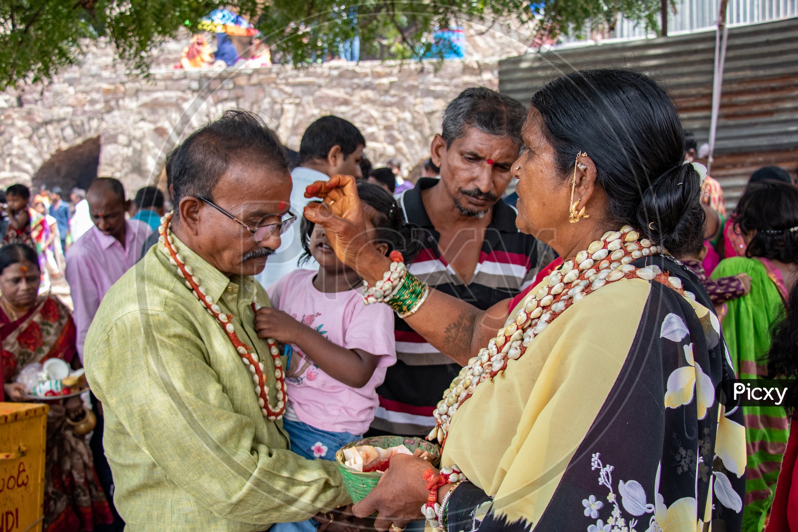 Devotees Taking Blessings From Maata Or  Goddess Woman At Bonalu