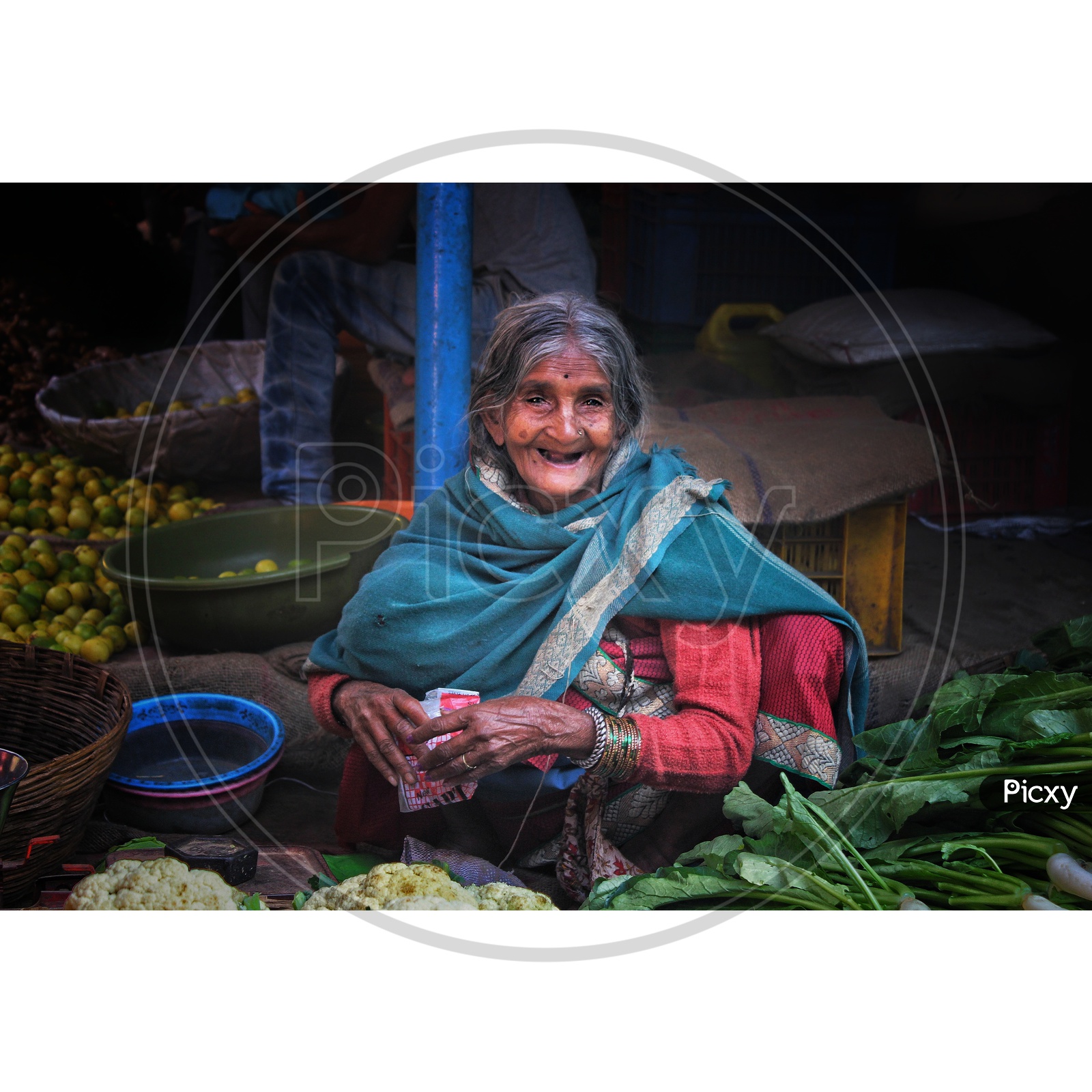 beautiful old lady selling vegetables