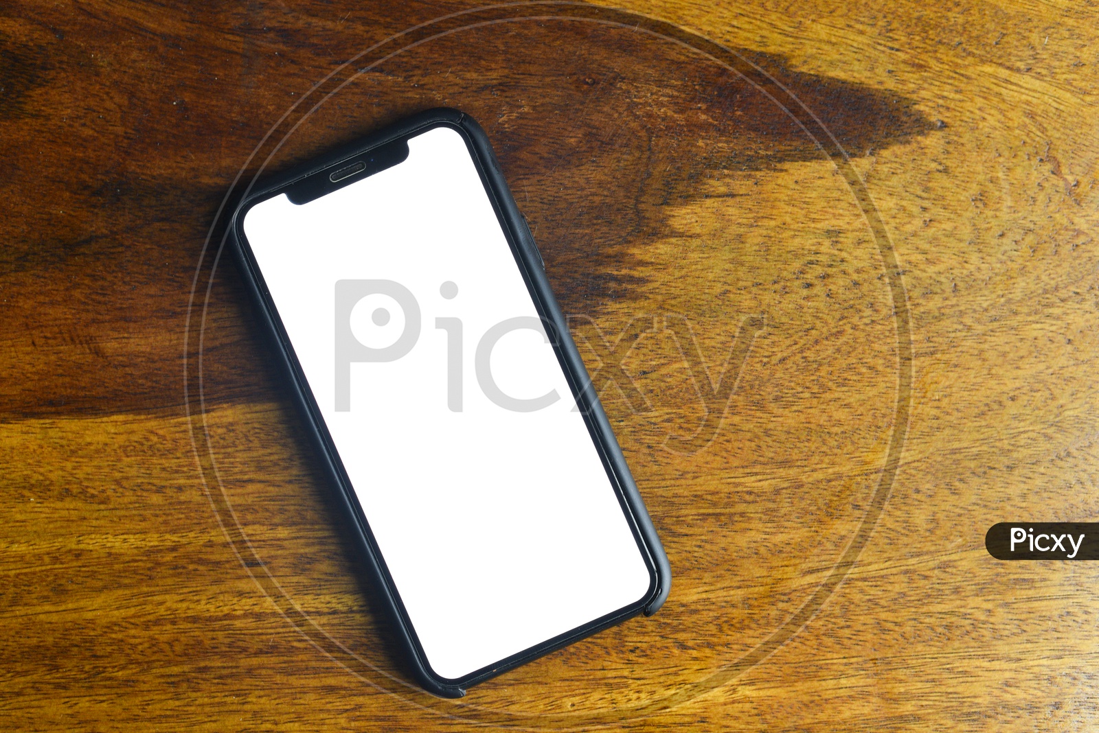 Smartphone or Mobile  With Empty Space Or White Space For Advertising Purpose  on an Wooden Background
