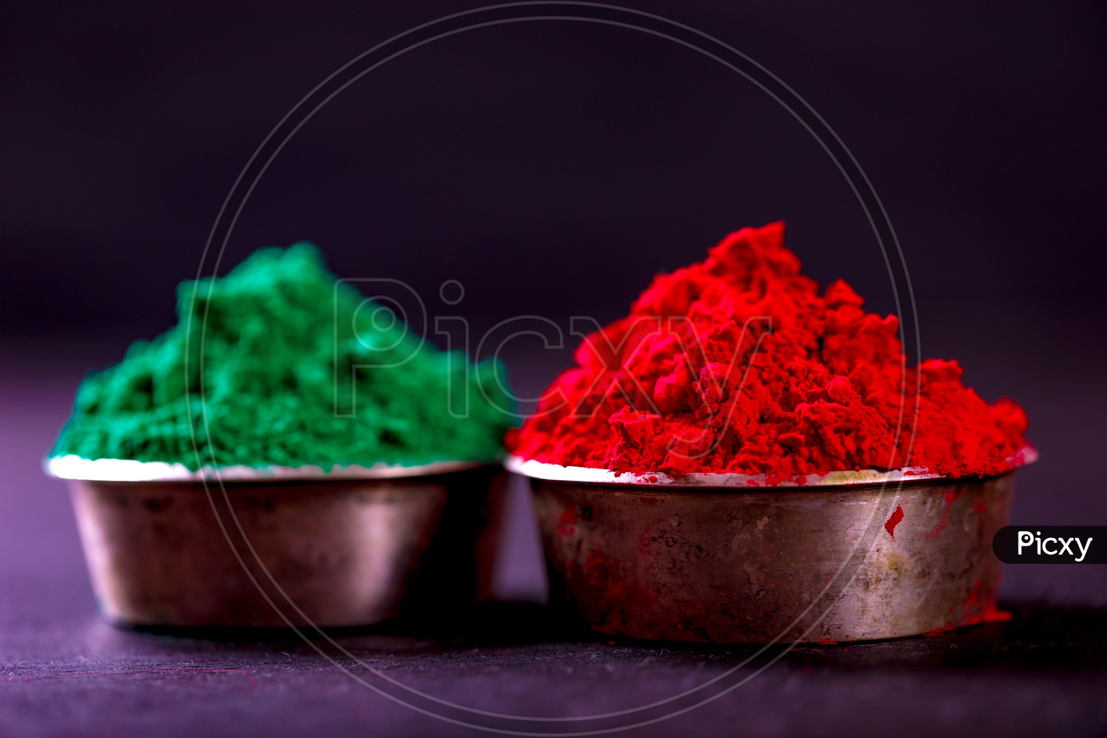 Holi Colours in Bowls On an isolated Black Background