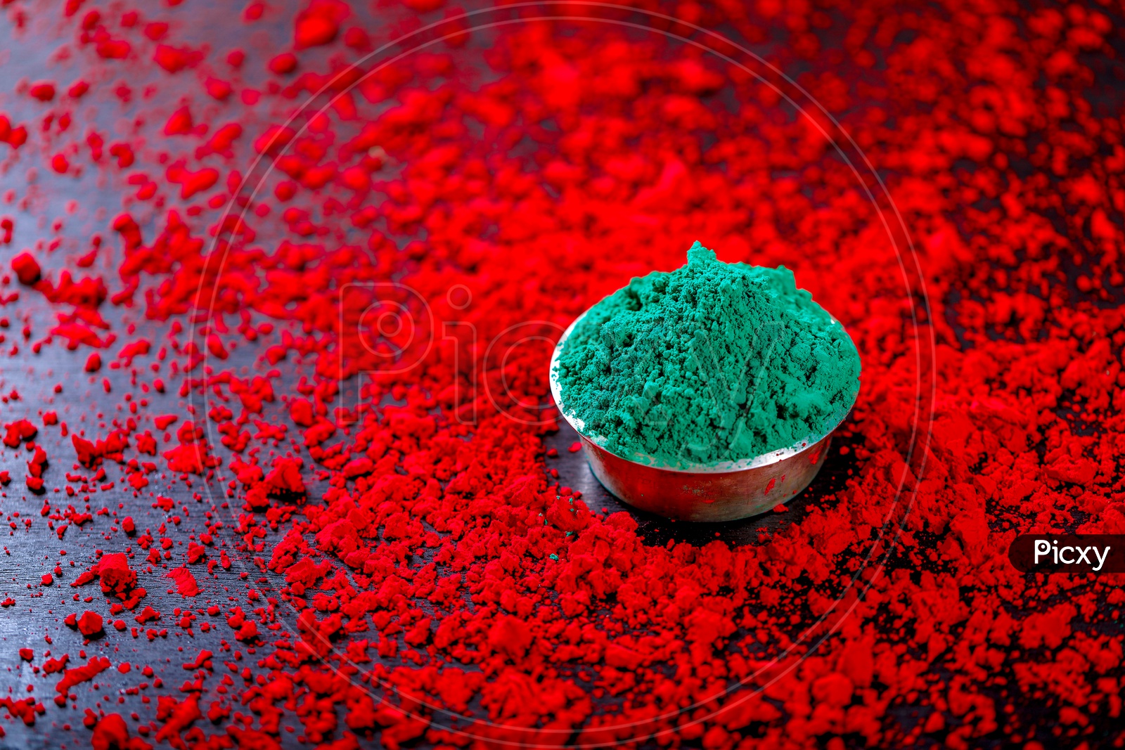 Sprinkled Holi Colors With Colour Bowls  on Black Background