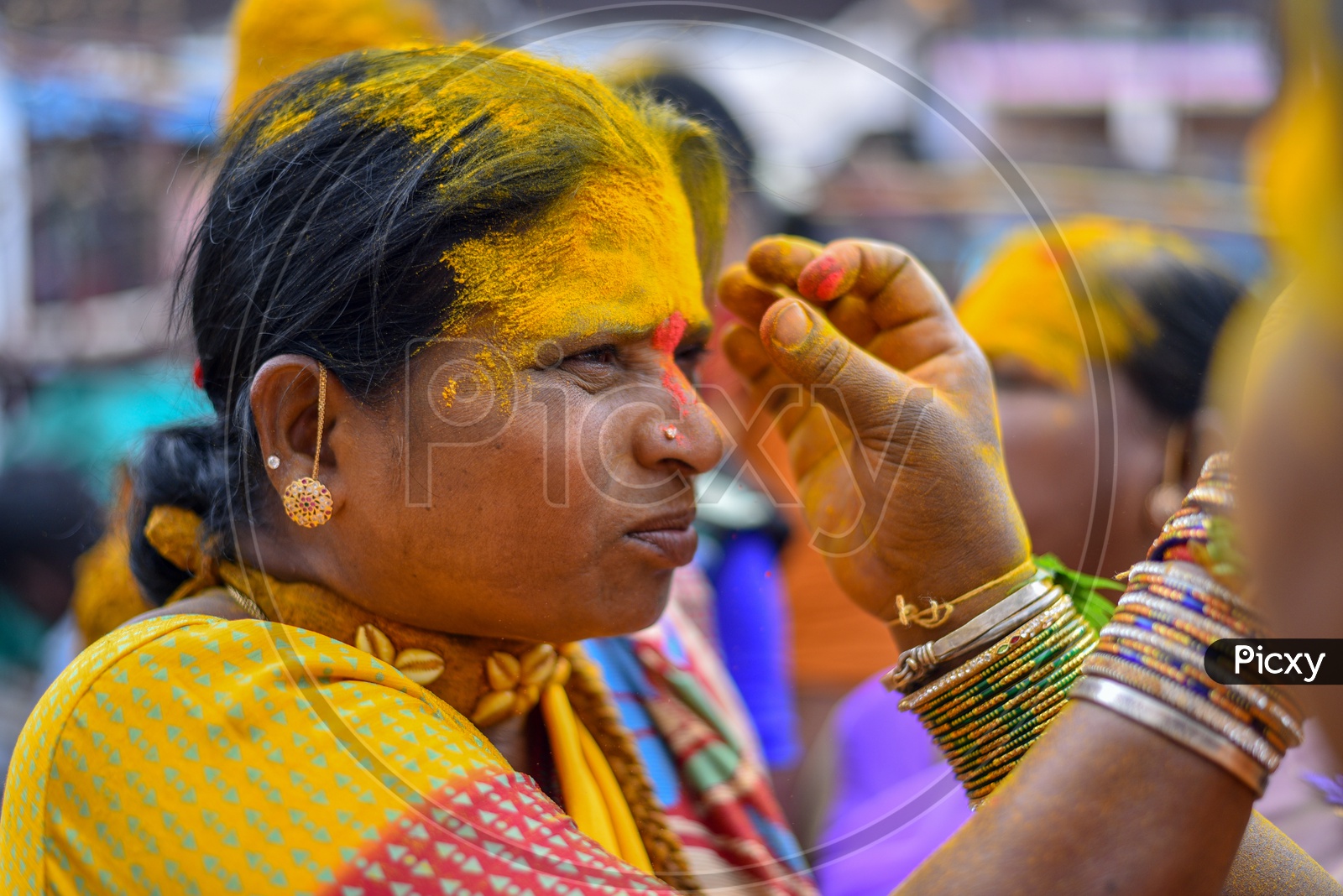 Woman Applying Vermilion To Their Foreheads As a Tradition  in Bonalu Festival