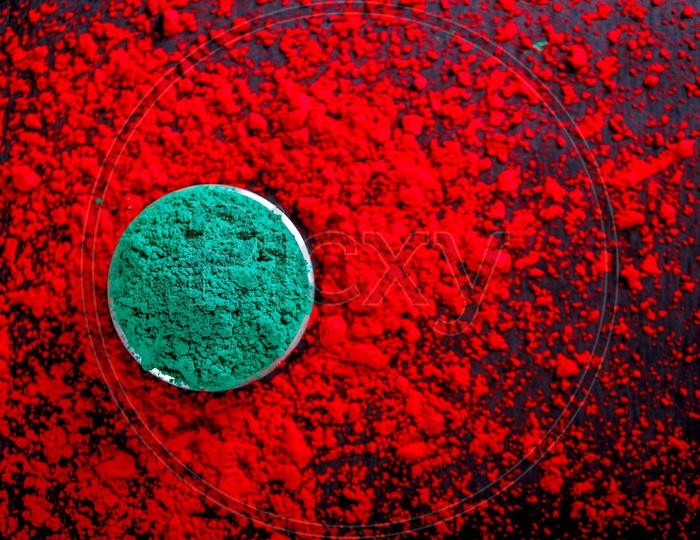 Sprinkled Holi Colors With Colour Bowls  on Black Background