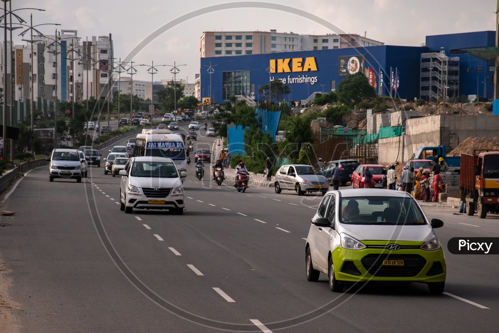 Traffic on four lane road at IKEA showroom, Gachibowli, Hyderabad.