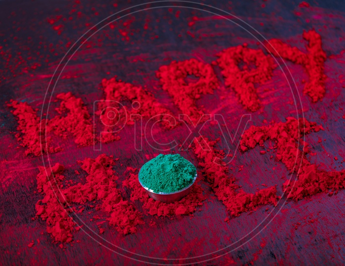 Happy  Holi  Wishes Written With Holi Colours on an Black Background
