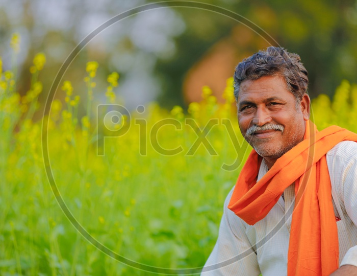 Indian Farmer In Agricultural Field With Happy Smile Face About His Corp