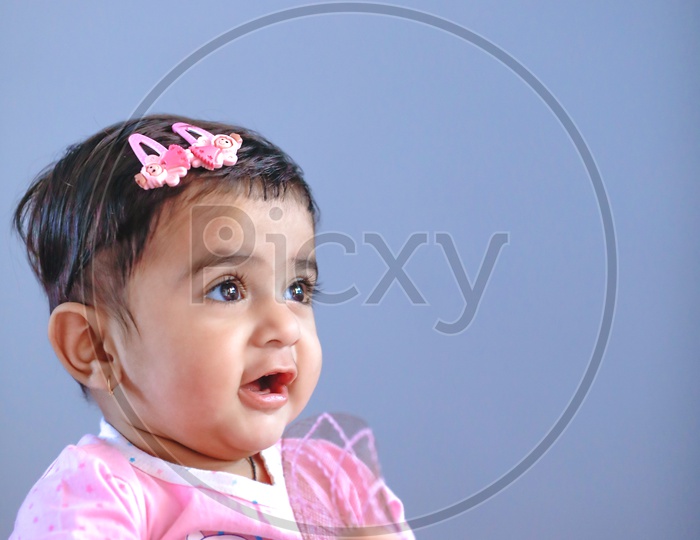 Cute Indian Baby Girl With Smiling Face On an Isolated  Background