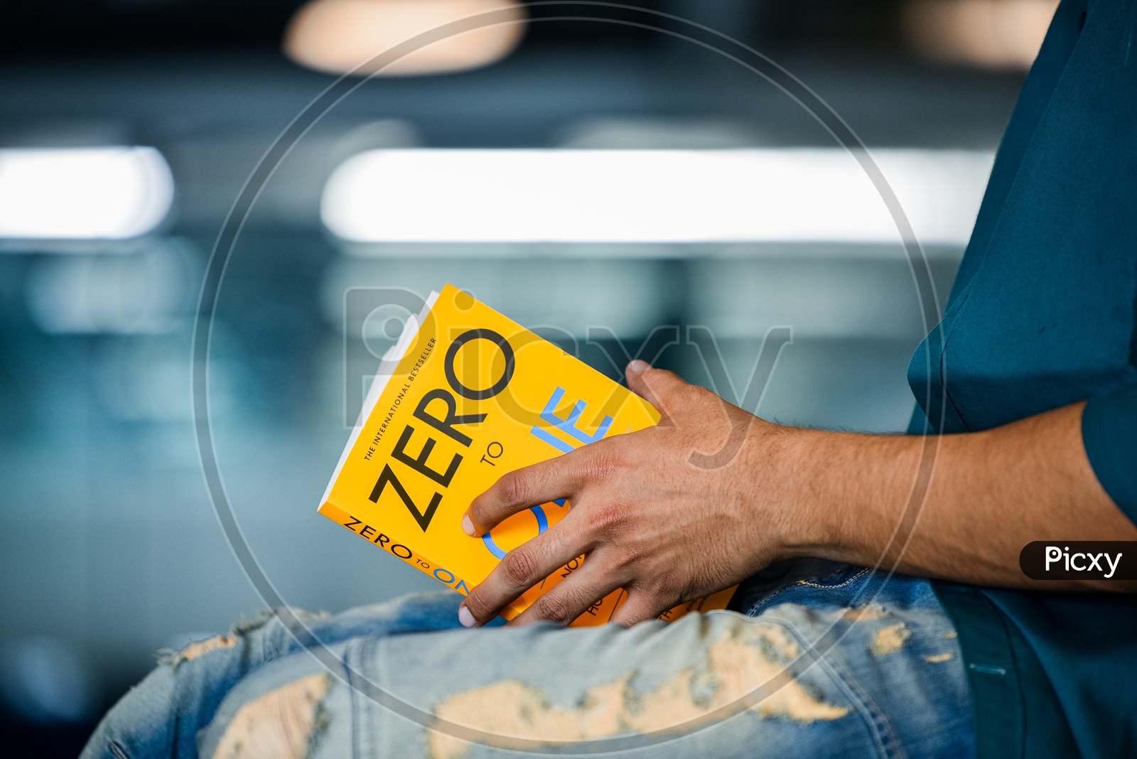 Young Man or Indian Man Or Student Reading Book Sitting Leisure  Closeup Of Hands