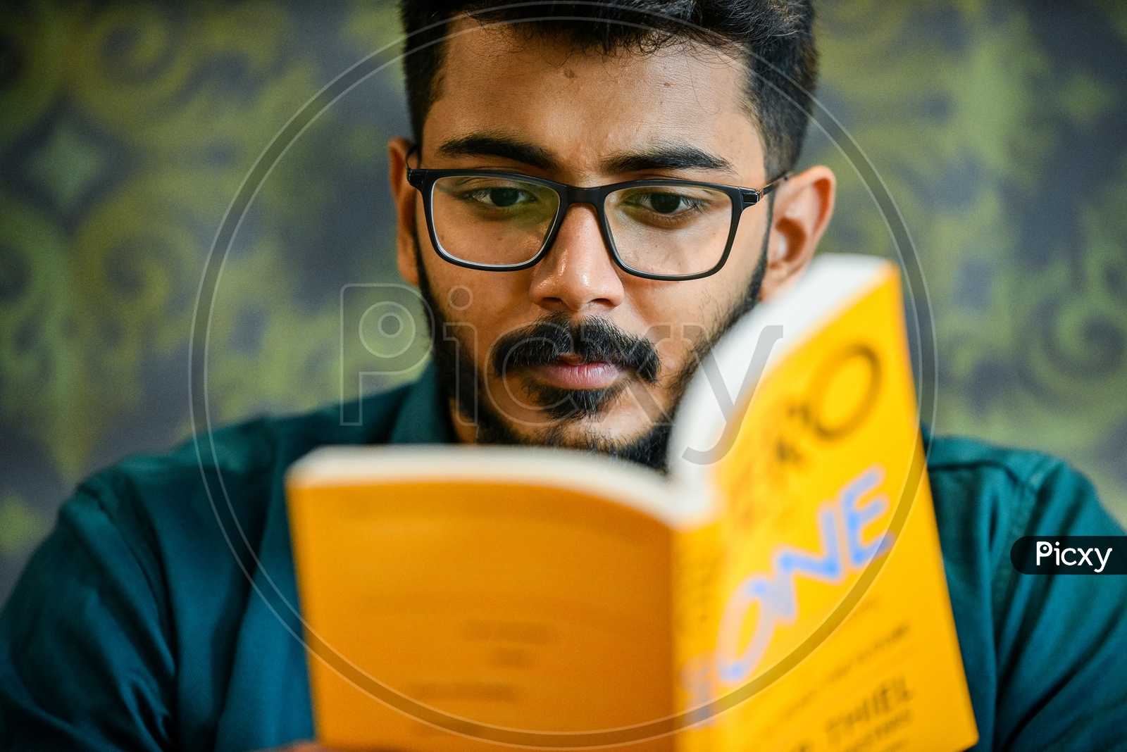 Young Man Or Indian Man Or Handsome Bearded Man or student Reading Book  or Novel