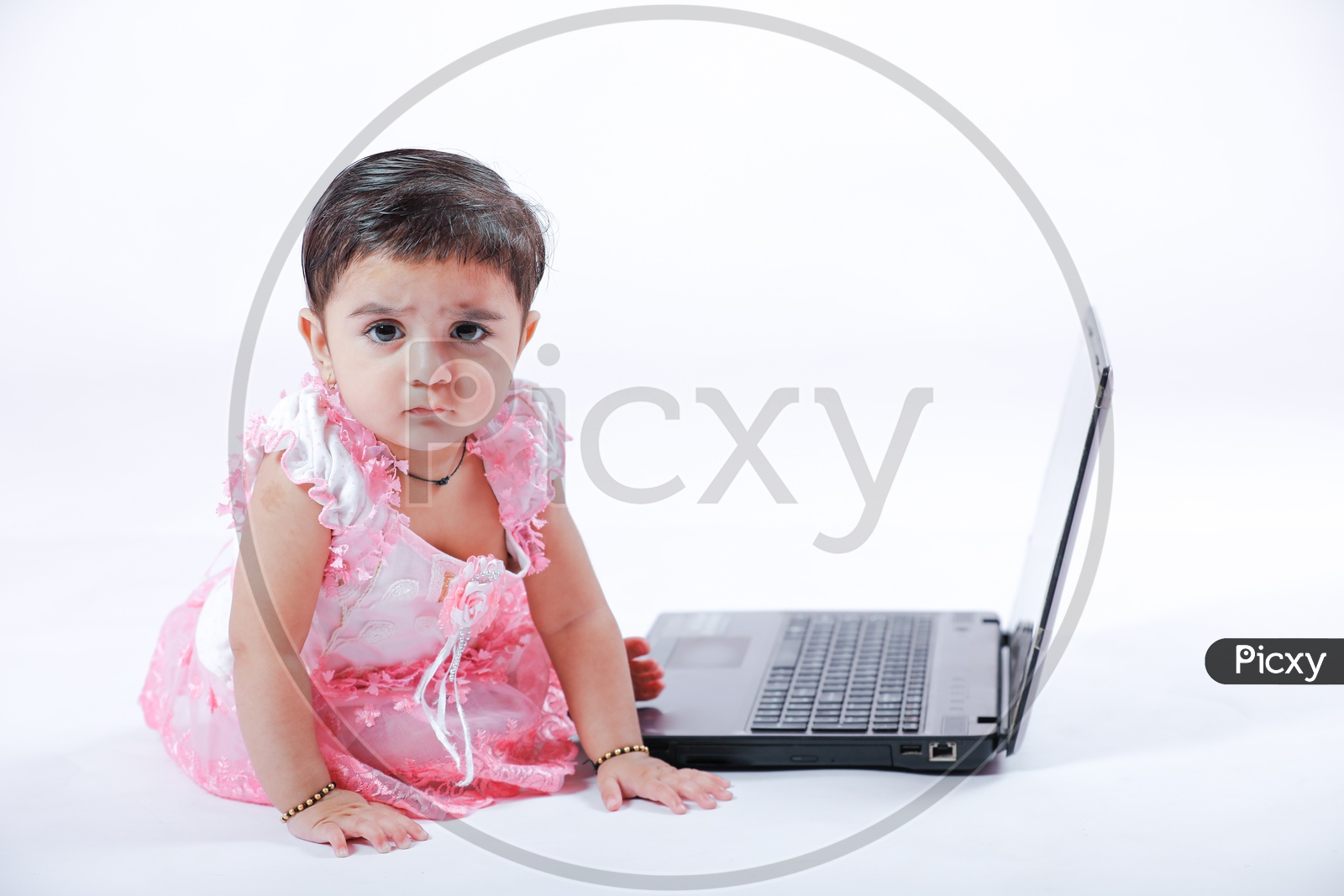 image-of-cute-indian-baby-girl-with-laptop-ja659026-picxy