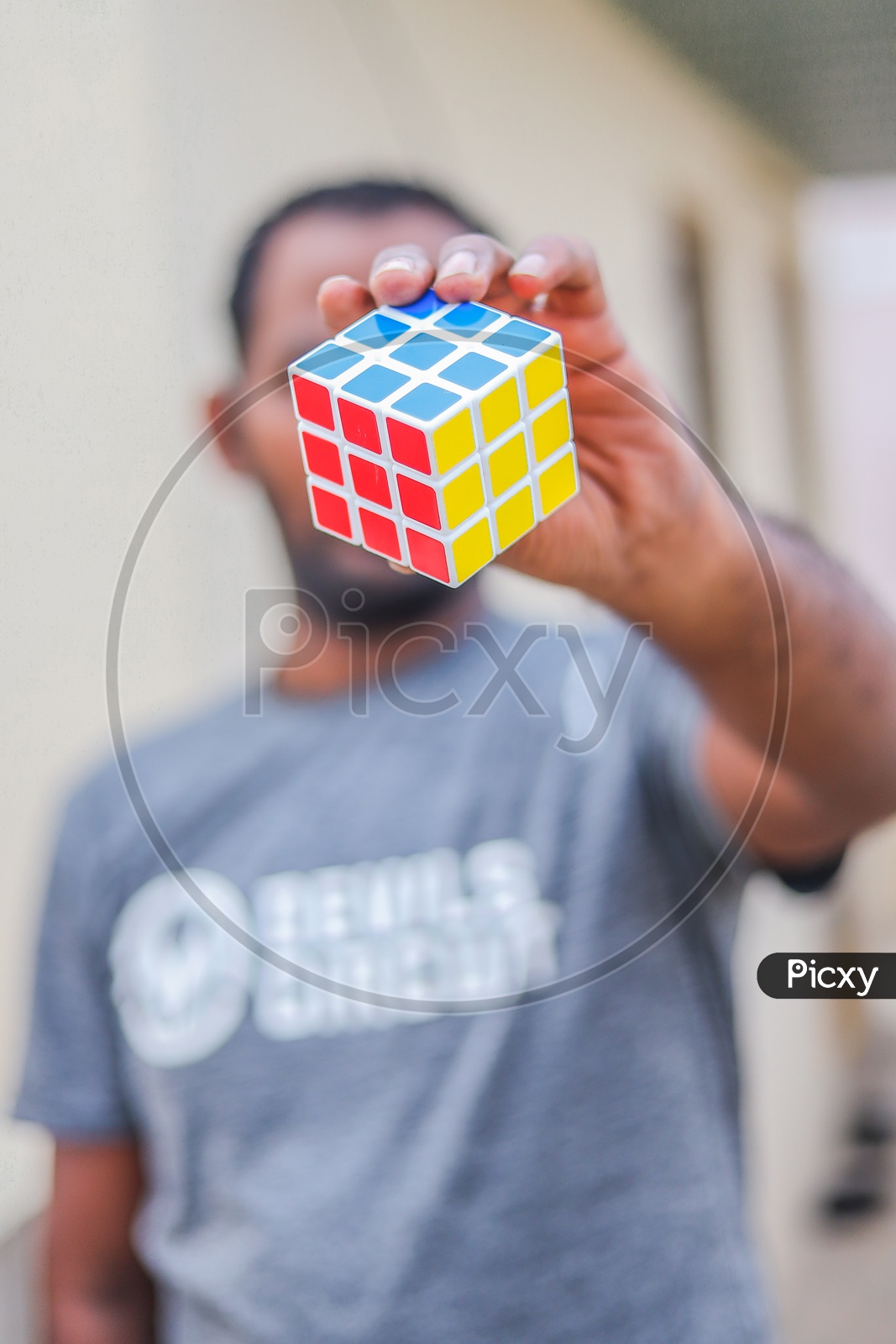 Hands and Rubik's cube puzzle isolated