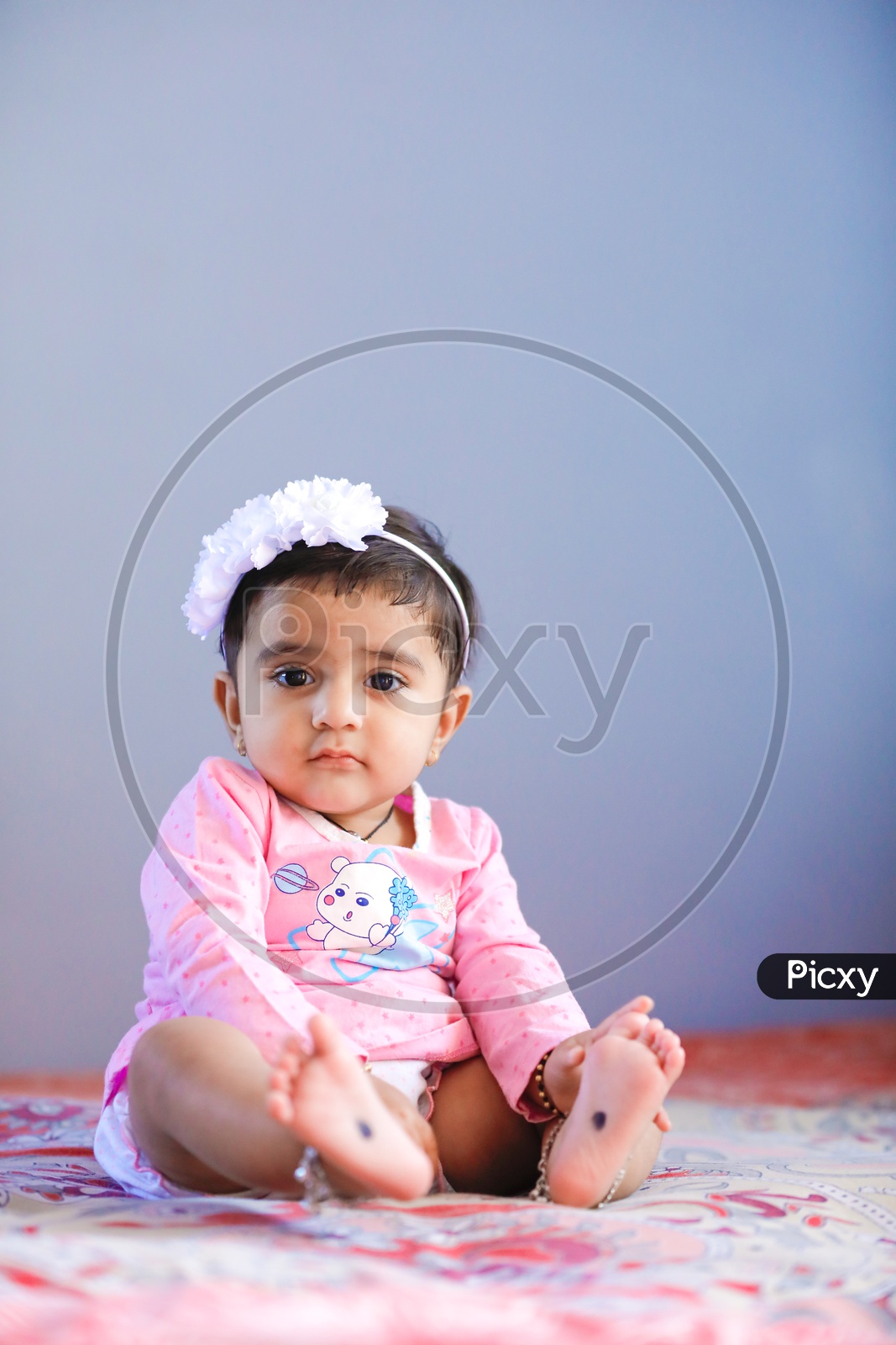 Image of Cute Indian Baby Girl With Cute Expression On FaceAT963748Picxy