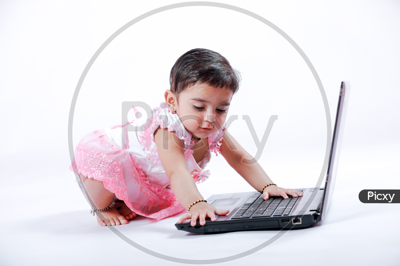 Cute Indian Baby Girl With Laptop