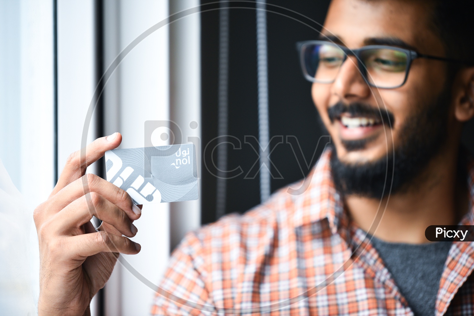 A Man Holding  Credit or Debit Or Card  in Hand  Closeup