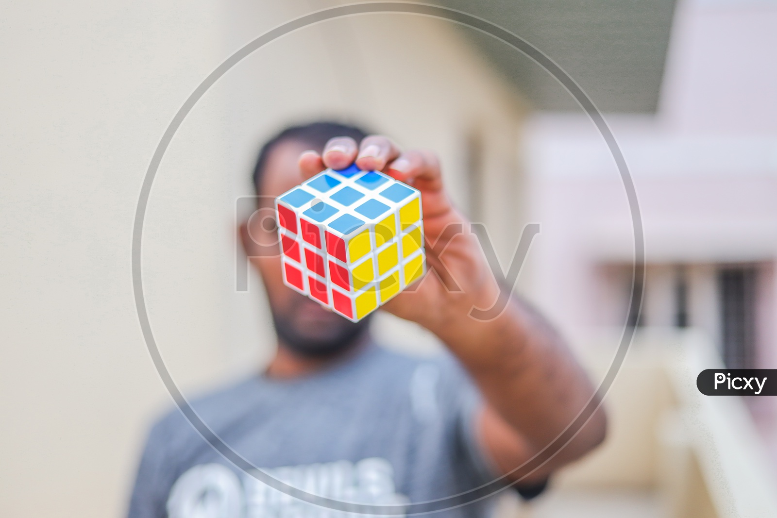Hands and Rubik's cube puzzle isolated