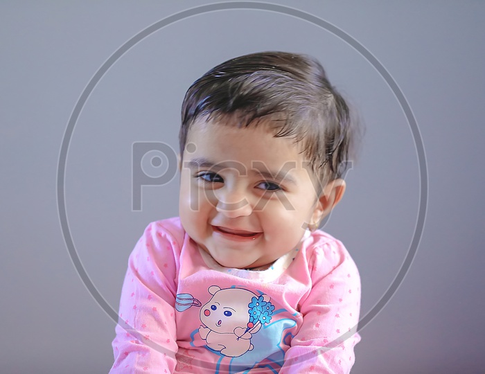 Cute Indian Baby Girl With Cute Expression On Face