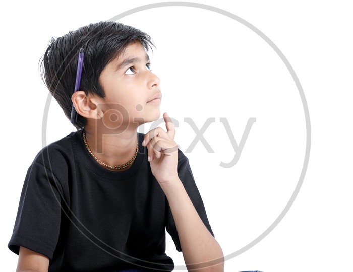 Indian or Asian boy Or Kid  with Expression of Seriously Thinking  On an Isolated White Background