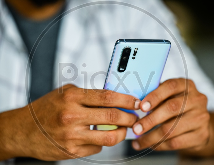 Young Man Or Indian Man or Student  Using  Mobile Or Smartphone Hands Closeup