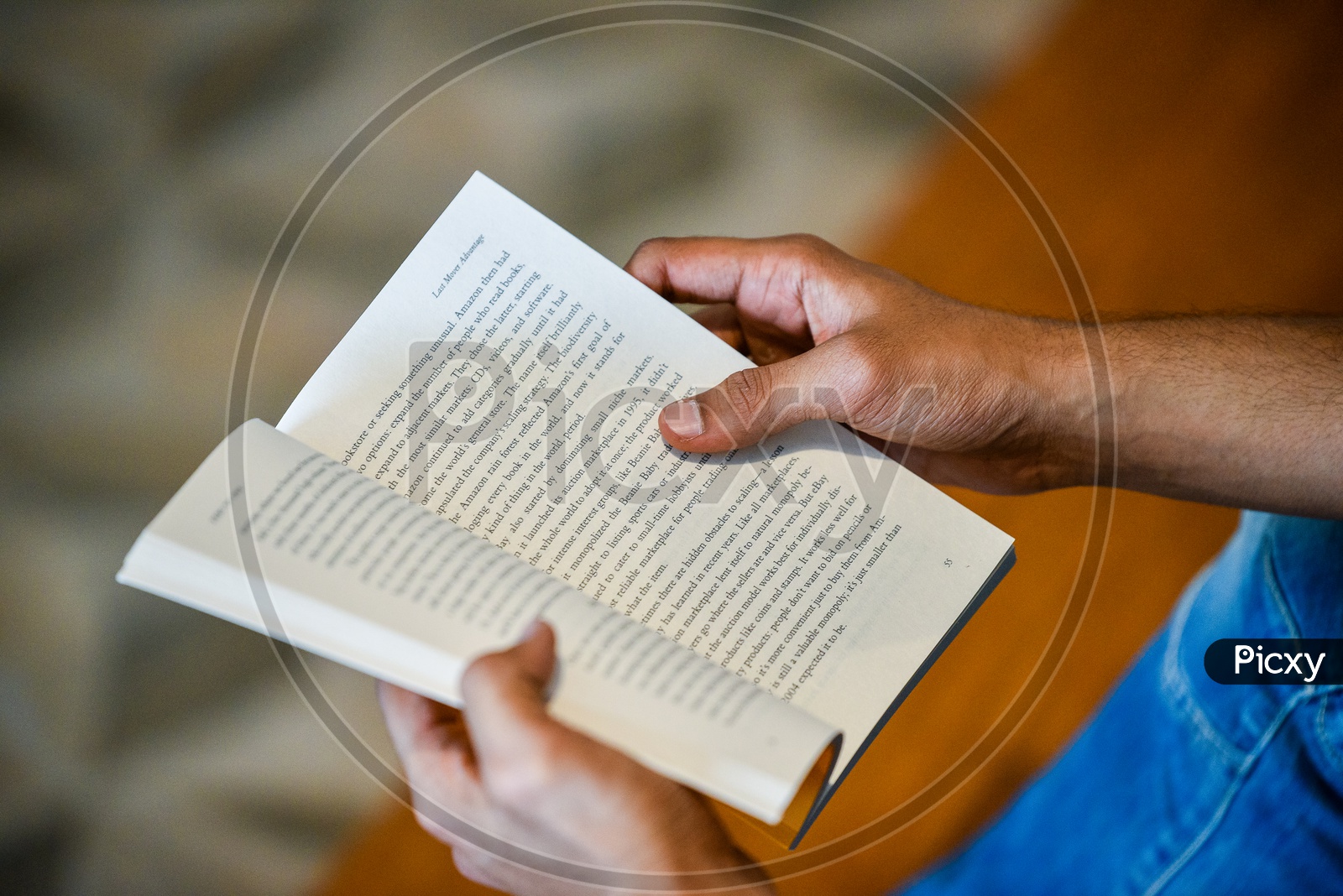 Young Man or Indian Man Or Student Reading Book Sitting Leisure  Closeup Of Hands
