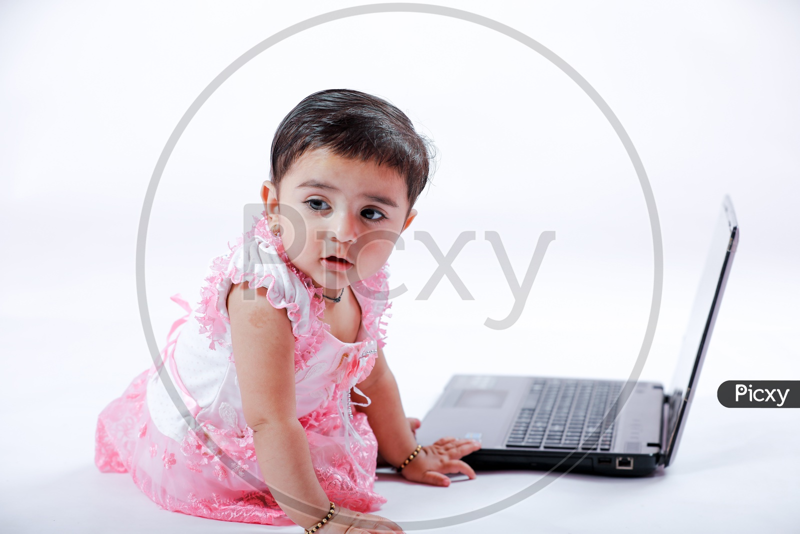Cute Indian Baby Girl With Laptop