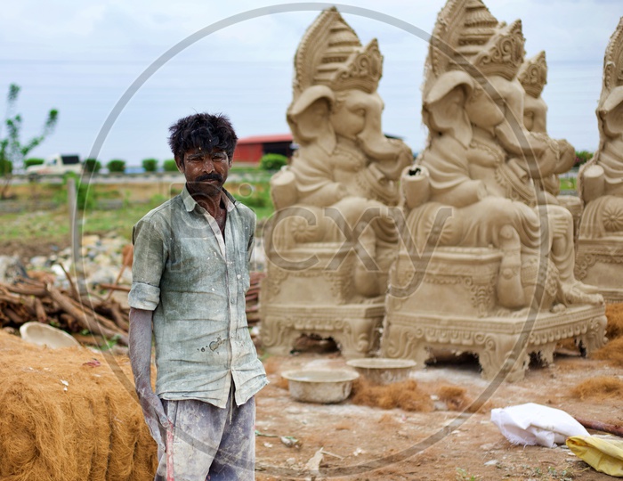 A worker who makes statues.