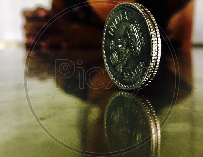 Indian coin and reflection,symmetry