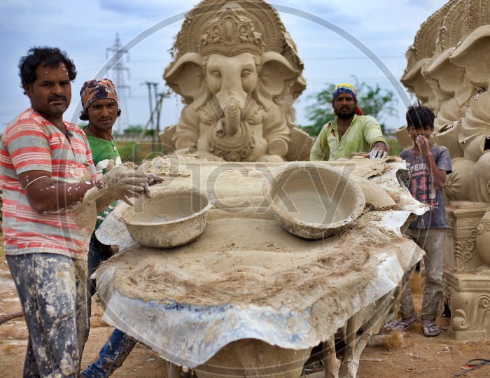 Workers making Vinayaka statues from Plaster of paris.