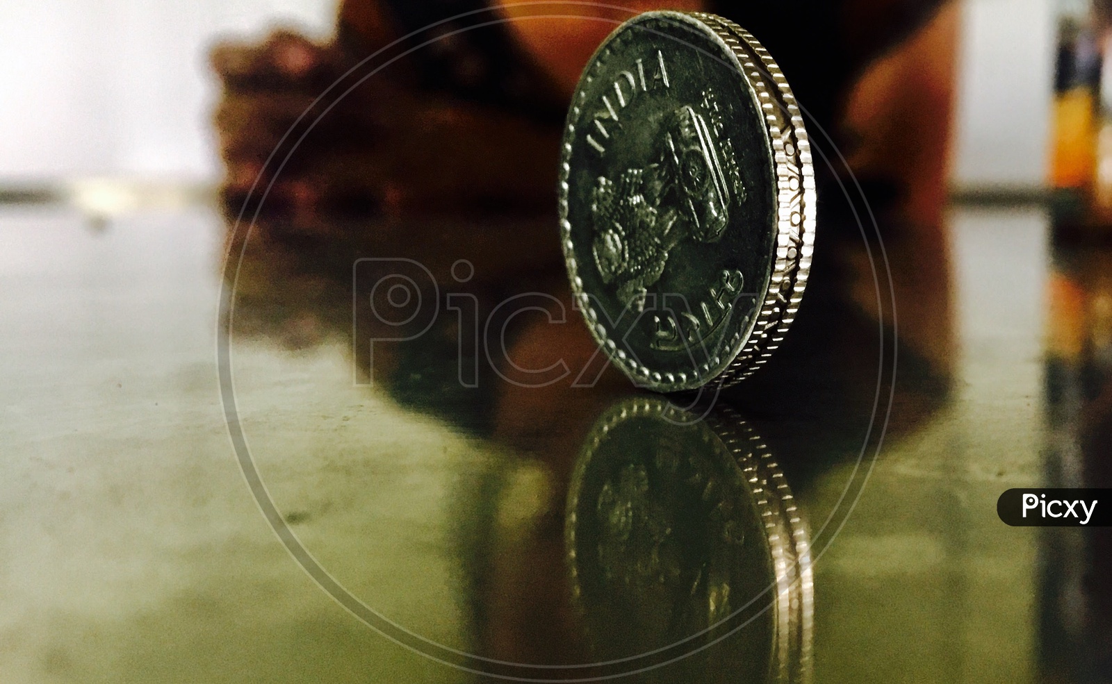 Indian coin and reflection,symmetry