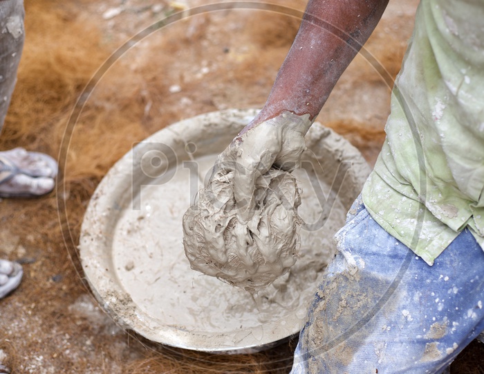 Plaster of paris mixture with dried grass used for making Lord Vinayaka sculptures.