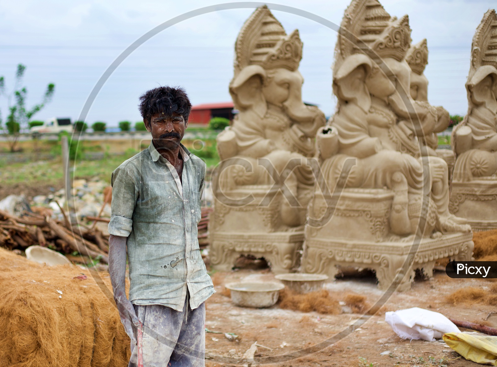 A worker who makes statues.