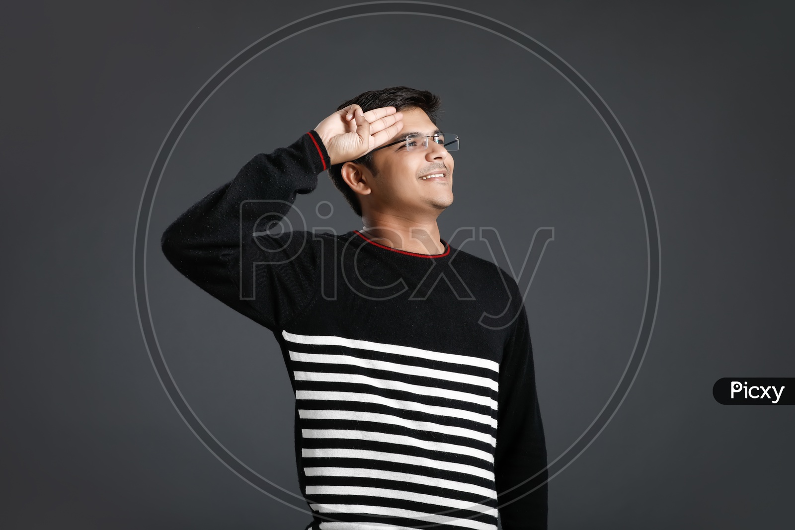 Young Indian Man or Asian Man  With Multiple Expressions Posing Over  an  Isolated Black Background
