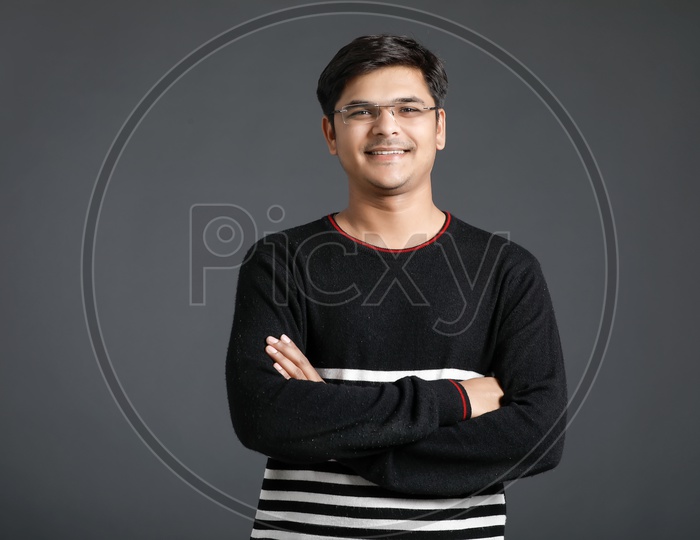 Young Indian Man or Asian Man  With Multiple Expressions Posing Over  an  Isolated Black Background