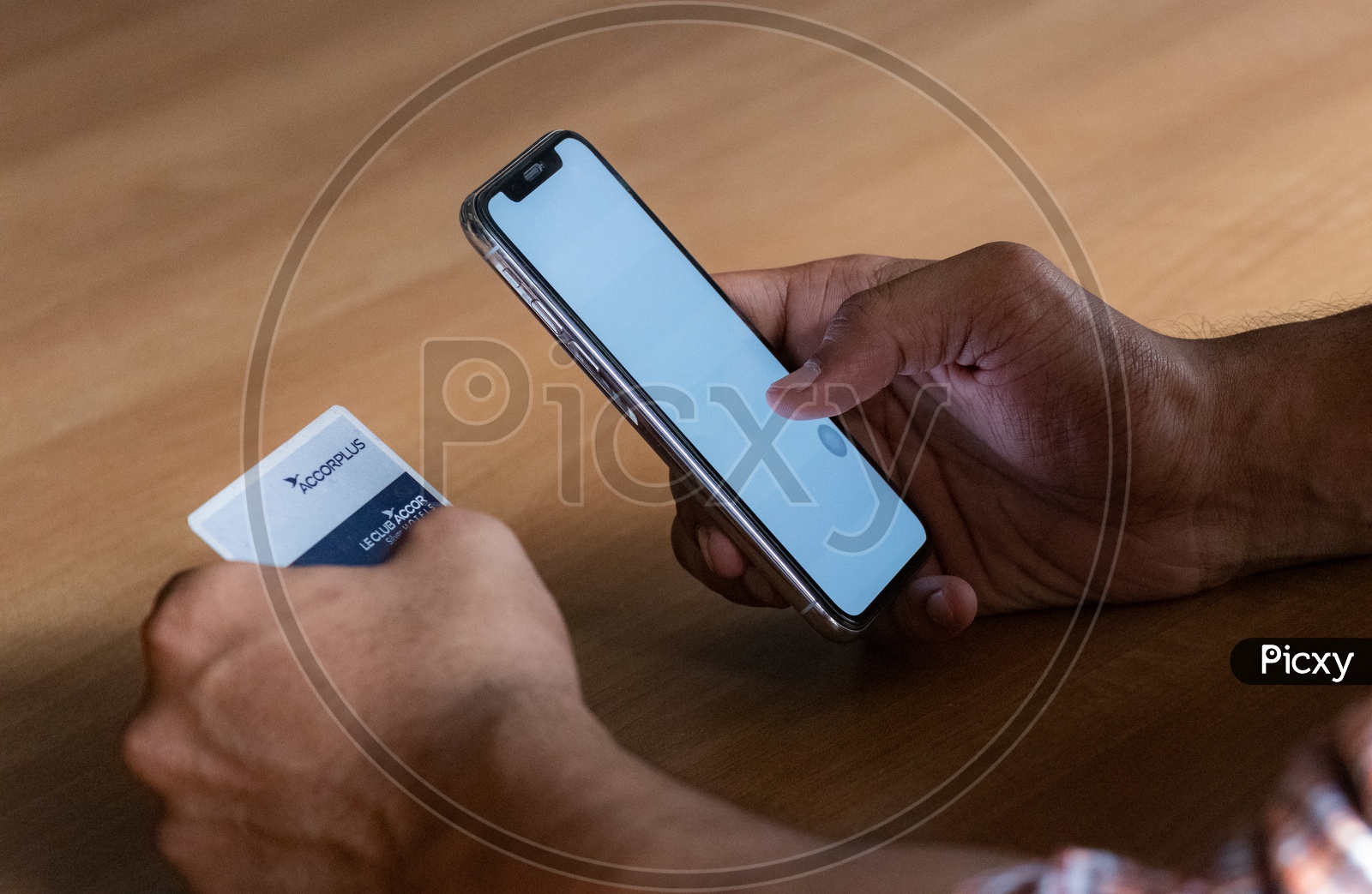 Online Payments Or Online Shopping  A Young Man Using Debit or Credit Card For Online Transaction or Payments in Smartphone or Mobile  Hands Closeup