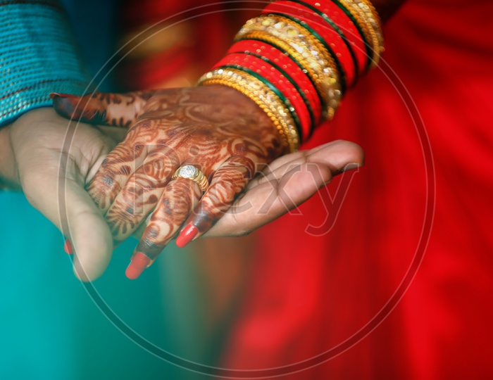 Couple Holding Hands Wearing Traditional Wear on an Marriage Engagement Ceremony
