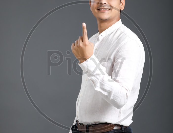 Indian Voter or  Man showing Inked Finger After Casting His Vote
