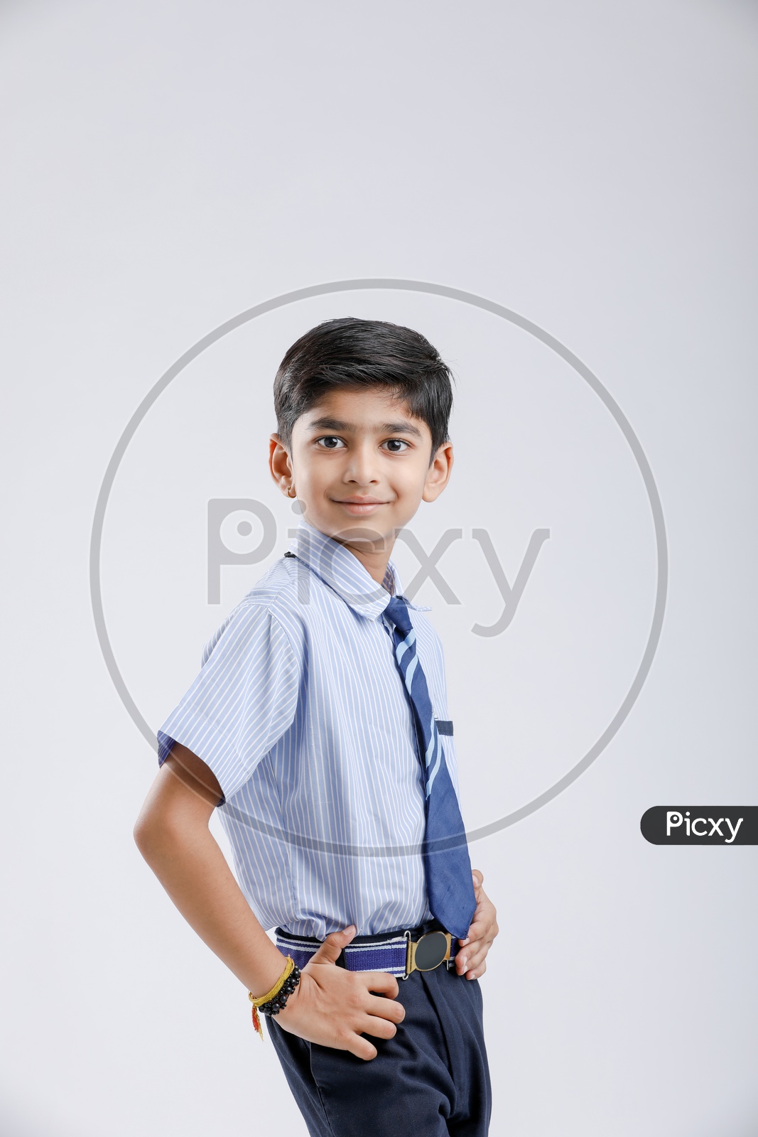 Indian Or Asian Boy Or Kid Or student in School Uniform  And  Posing  Over an Isolated White Background