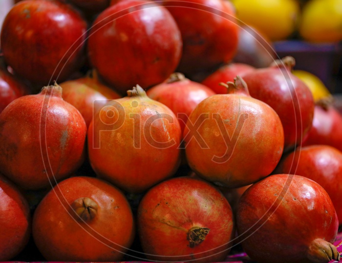Pomegranate Fruit In Fruit Vendor Shop Or Stall