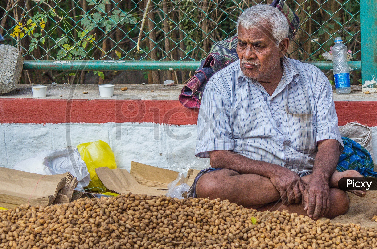Old Man selling groundnuts