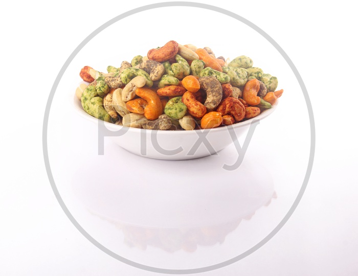 Spicy Roasted Cashew Nuts In A Bwl On an Isolated Background