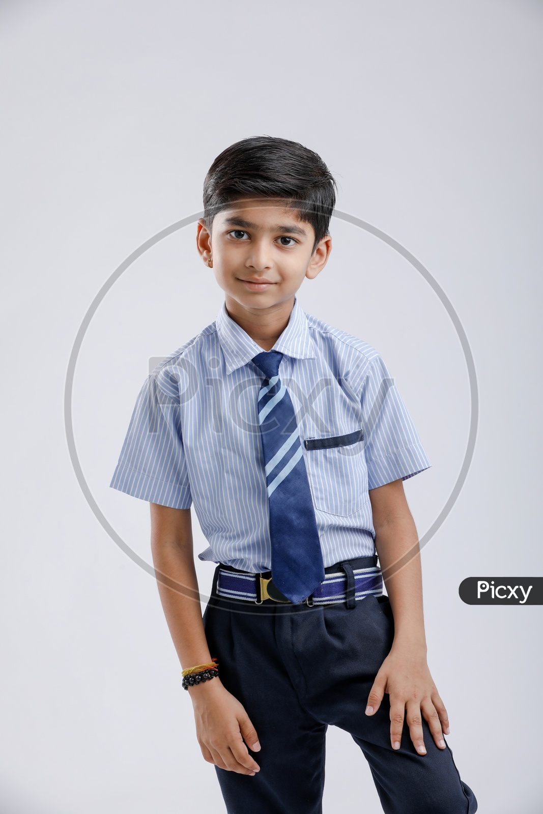 Indian Or Asian Boy Or Kid Or student in School Uniform  And  Posing  Over an Isolated White Background