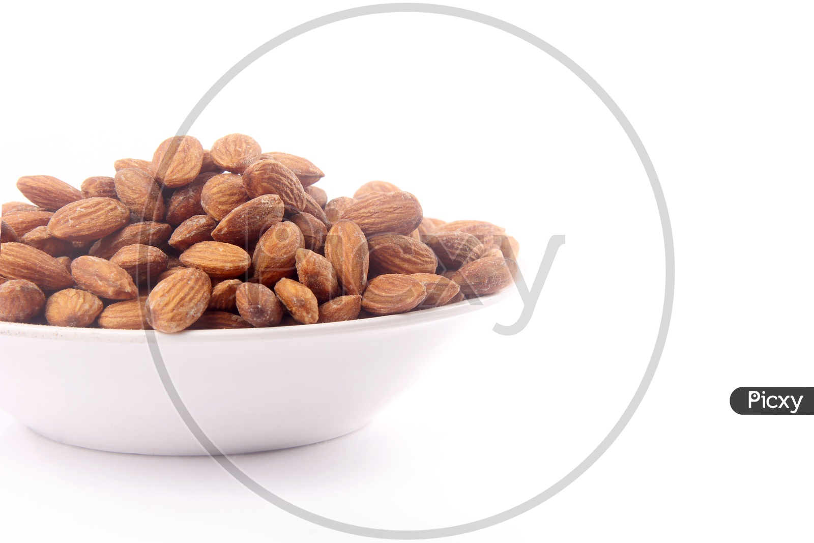 Roasted Almonds Or Badam Nuts In a Bowl On an Isolated White Background