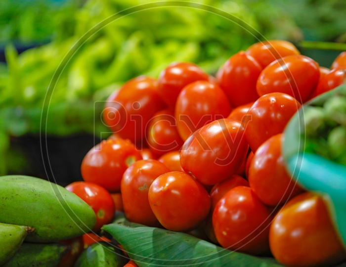 Fresh Tomatoes  In  a Vegetable Vendor Stall or Shop in Market