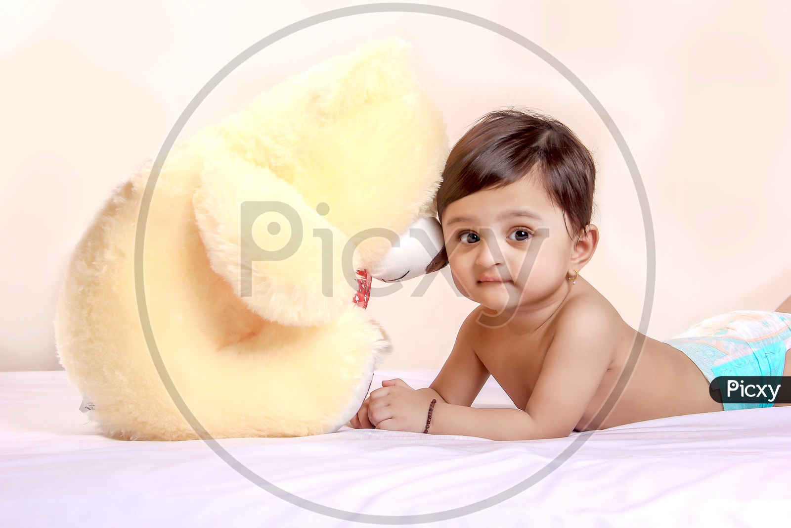 Cute Indian Baby Child Playing With Toys Or Dolls
