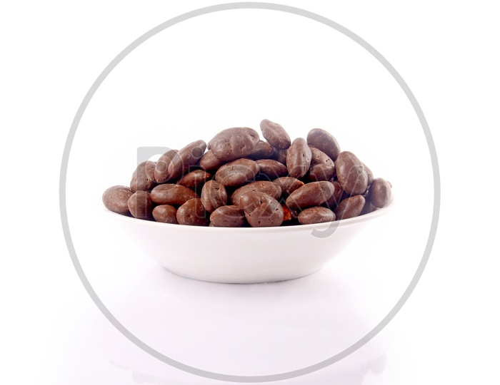 Chocolate Coated Almonds Or Badam Nuts in a Bowl