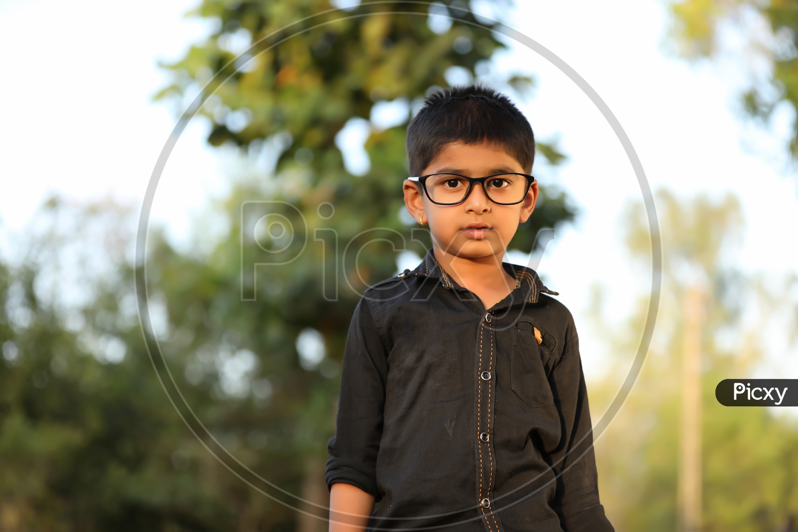 Indian Young  Boy Or Child Or Kid Wearing Spectacles And Posing