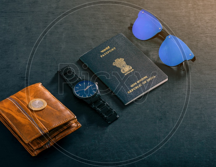 Travel Concept  Indian Passport , Watch ,wallet , Sun Glasses and Indian Coin