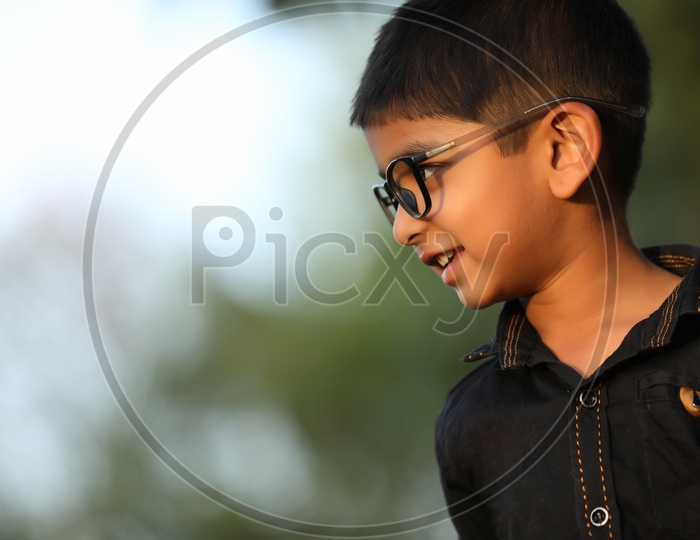 Indian Young Boy Wearing Spectacles And Posing
