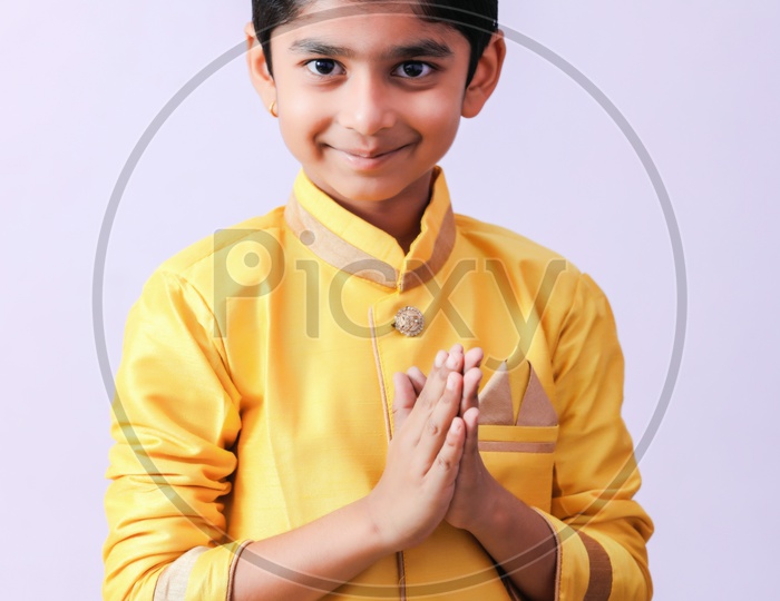 Young Boy Kid Child  in Traditional Wear With Namste Gestures And Posing