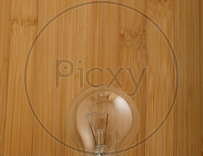 Bulb Or Electric Bulb On Wooden Background