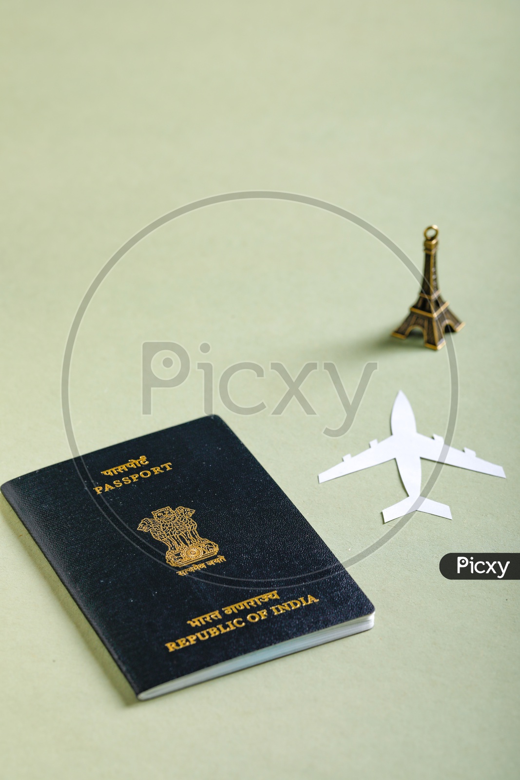 Travel Concept   Indian Passport , Paper Flight  and Eiffel Tower On an isolated Background